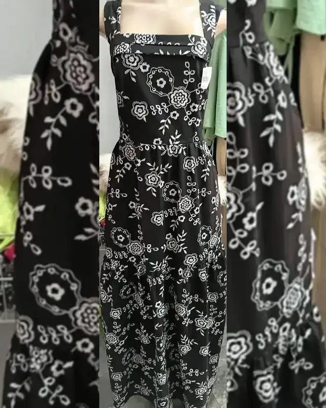 Vestido longo preto de alça larga com flores brancas bordadas